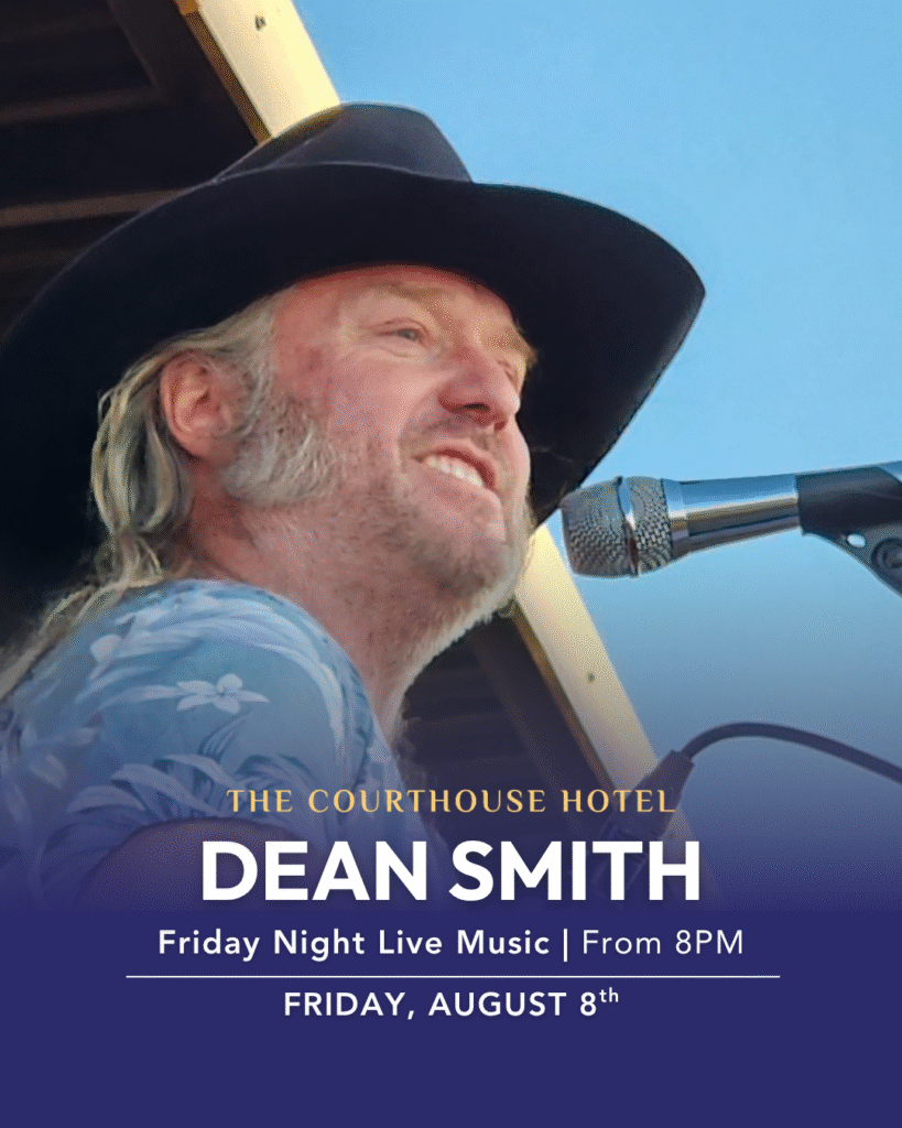Dean Smith playing acoustic guitar on stage at The Courthouse Hotel Smythesdale