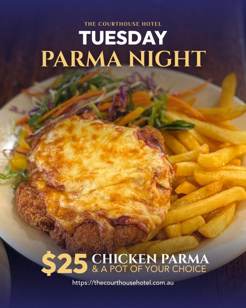 Chicken parma with chips and salad on a plate for Tuesday Parma Night at The Courthouse Hotel Smythesdale.