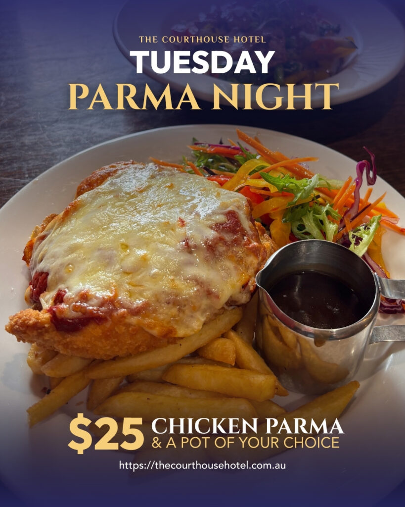 Chicken parma with chips and salad on a plate for Tuesday Parma Night at The Courthouse Hotel Smythesdale.